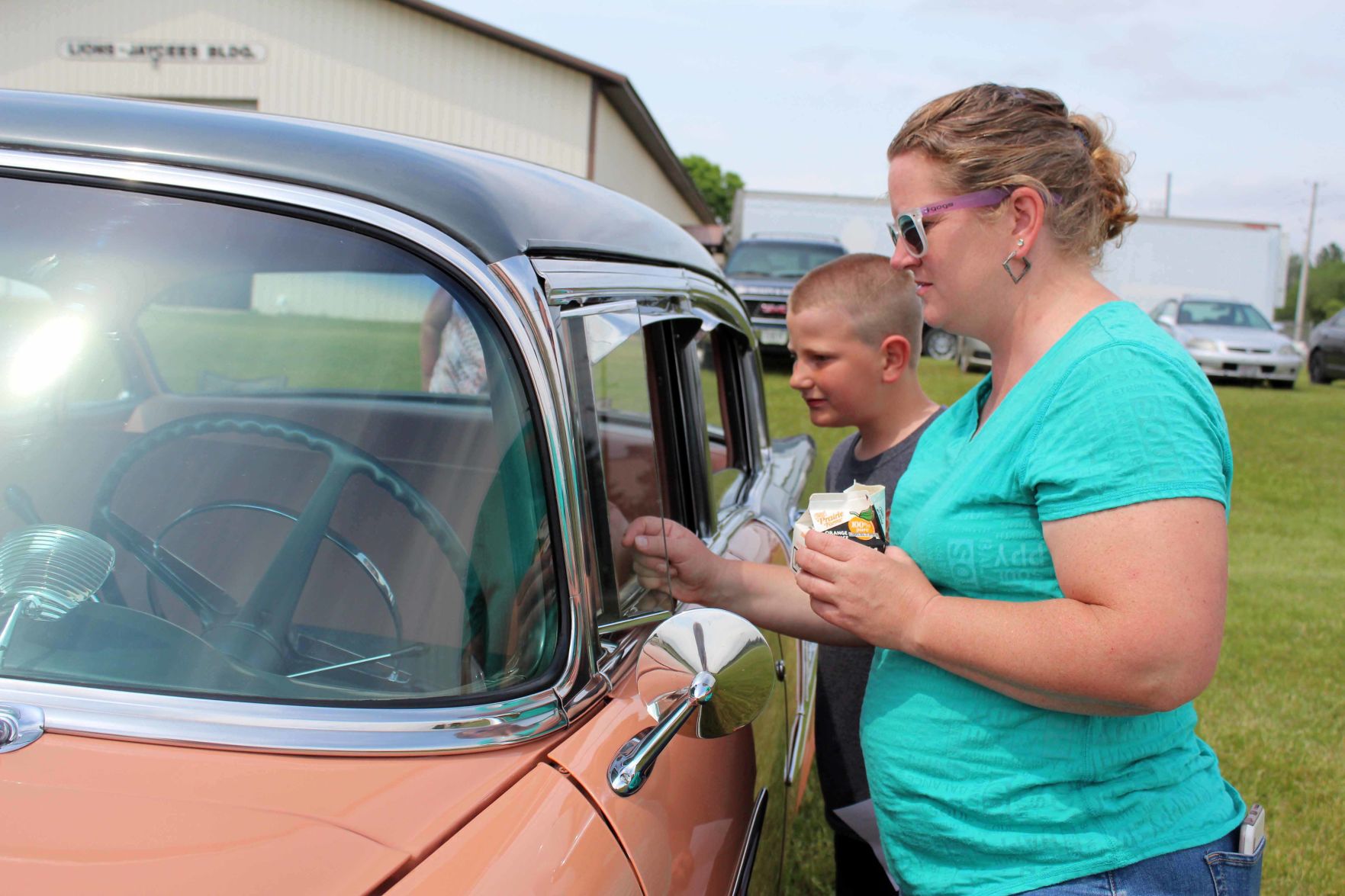 Penny and Henry look at car